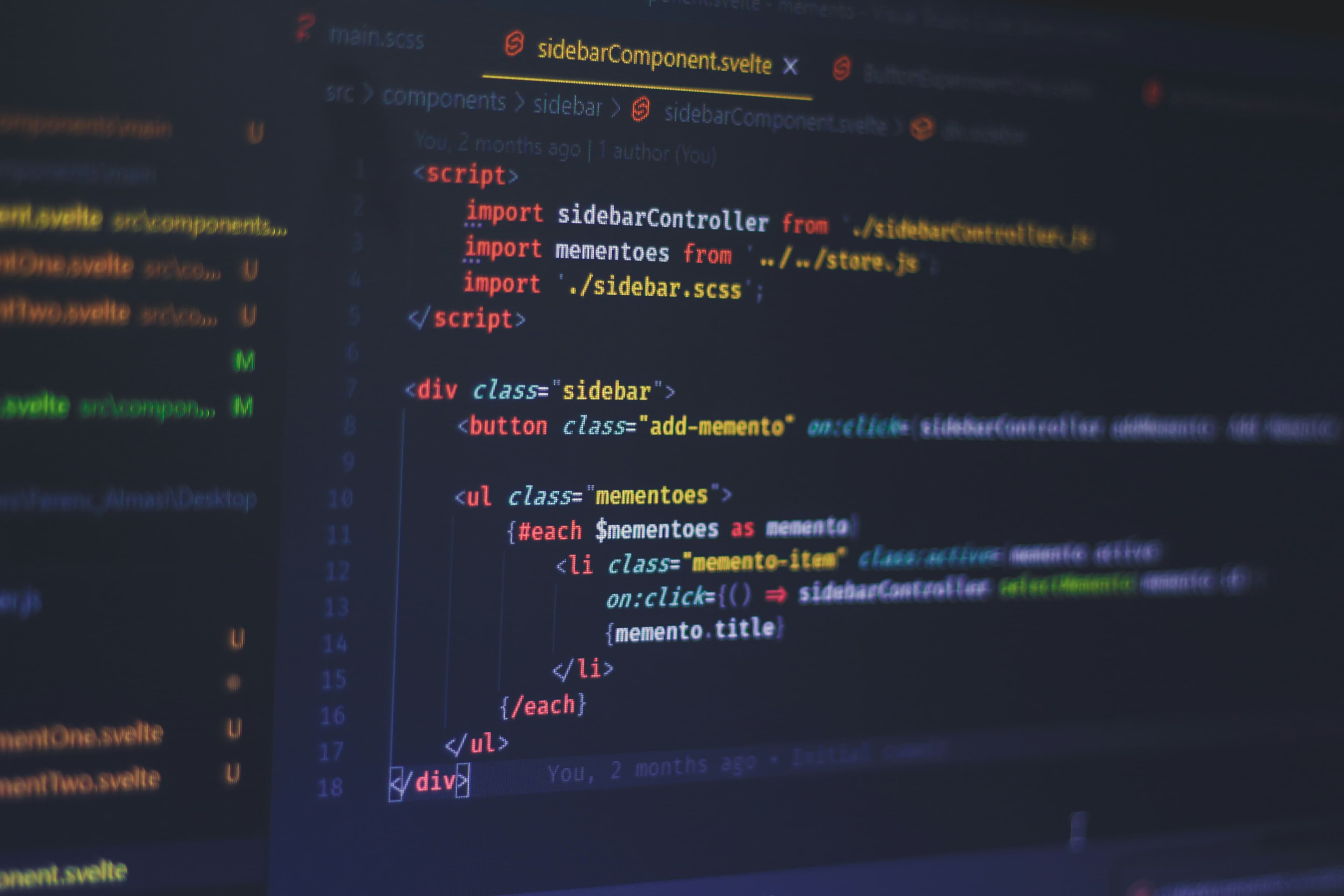 Modern web development workspace showing code on multiple screens